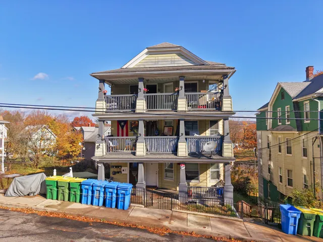 a front view of a building with street view