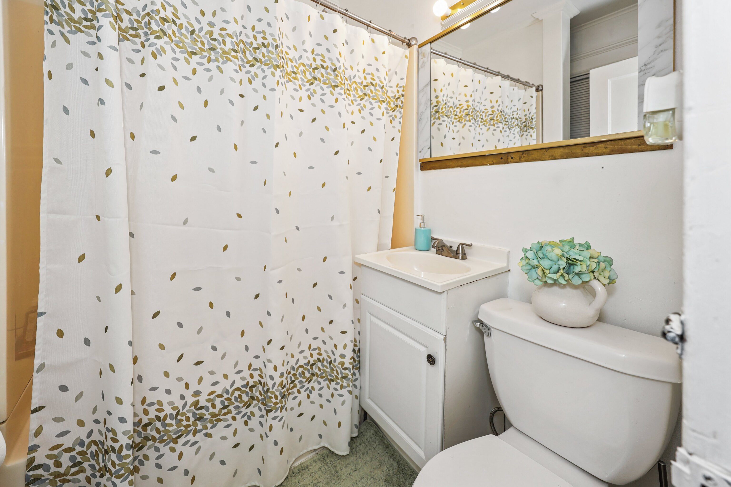 62 Poplar Street Waterbury, CT 06708 - Photo 15 of 23 a bathroom with a toilet sink and mirror