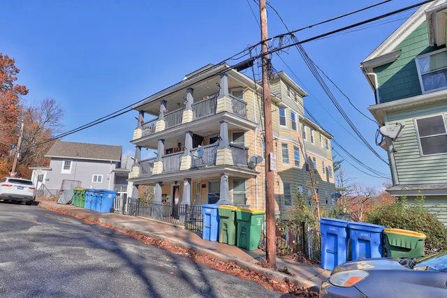 a city street lined with buildings and cars