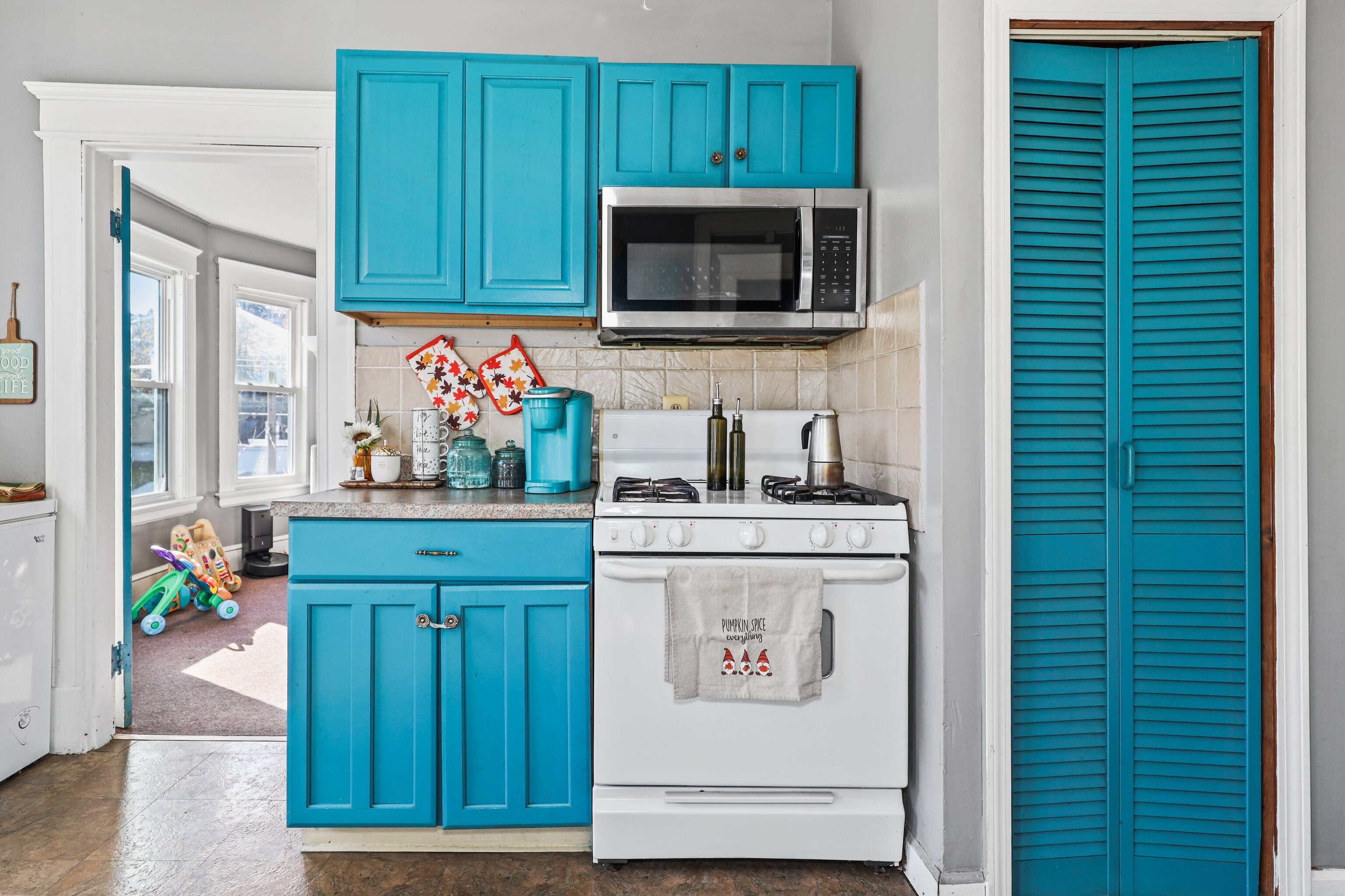 62 Poplar Street Waterbury, CT 06708 - Photo 8 of 23 a kitchen with kitchen island a sink and a microwave