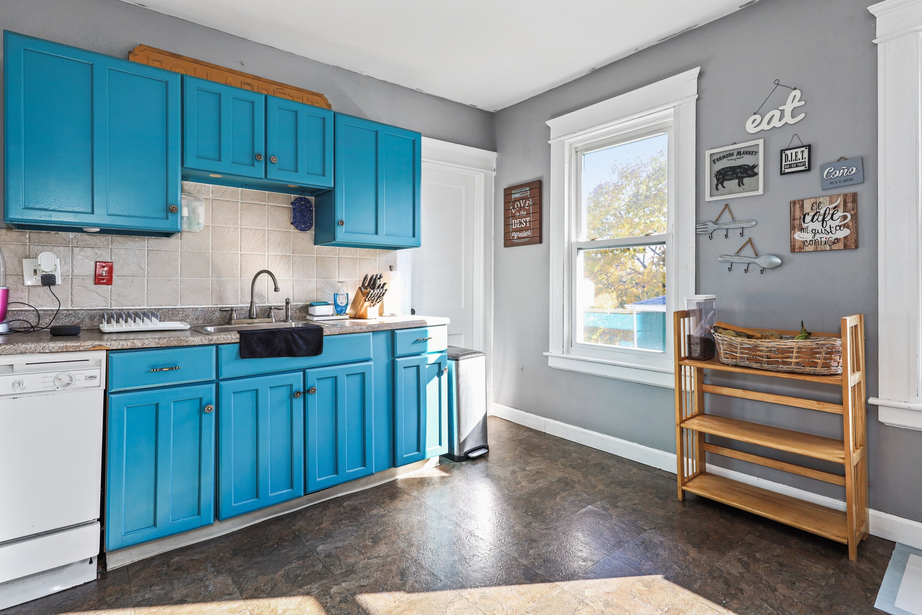 62 Poplar Street Waterbury, CT 06708 - Photo 10 of 23 a kitchen with wooden cabinets and a sink
