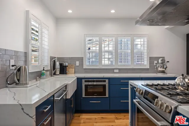a kitchen with a stove and a sink