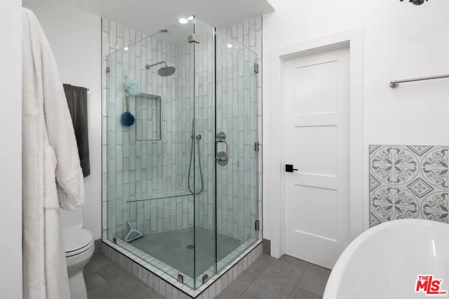 a bathroom with a shower and a bathtub