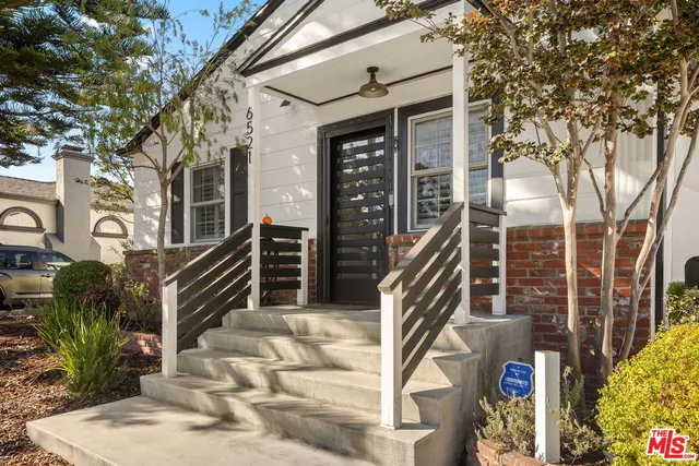 a front view of a house with stairs