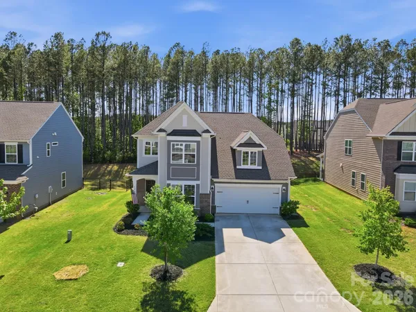 a aerial view of a house with a yard