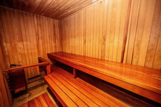 a sitting area with wooden floor