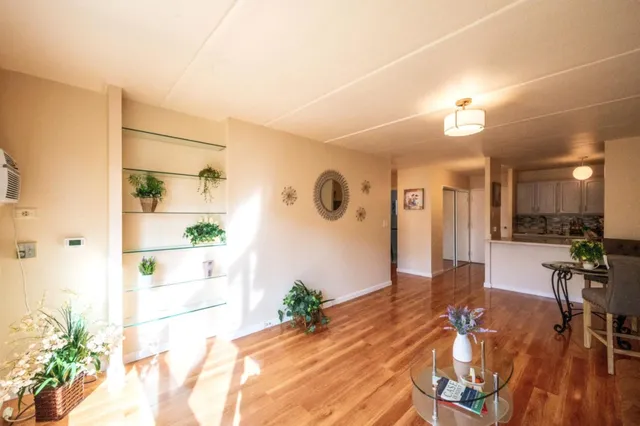 a view of a living room and a wooden floor