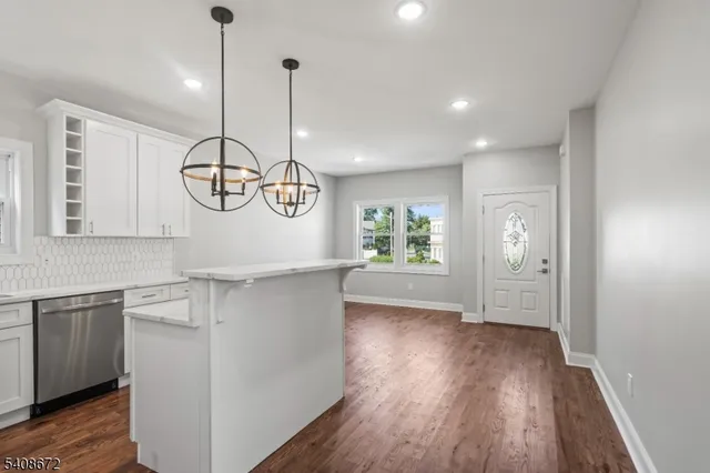 a very nice looking room with wooden floor