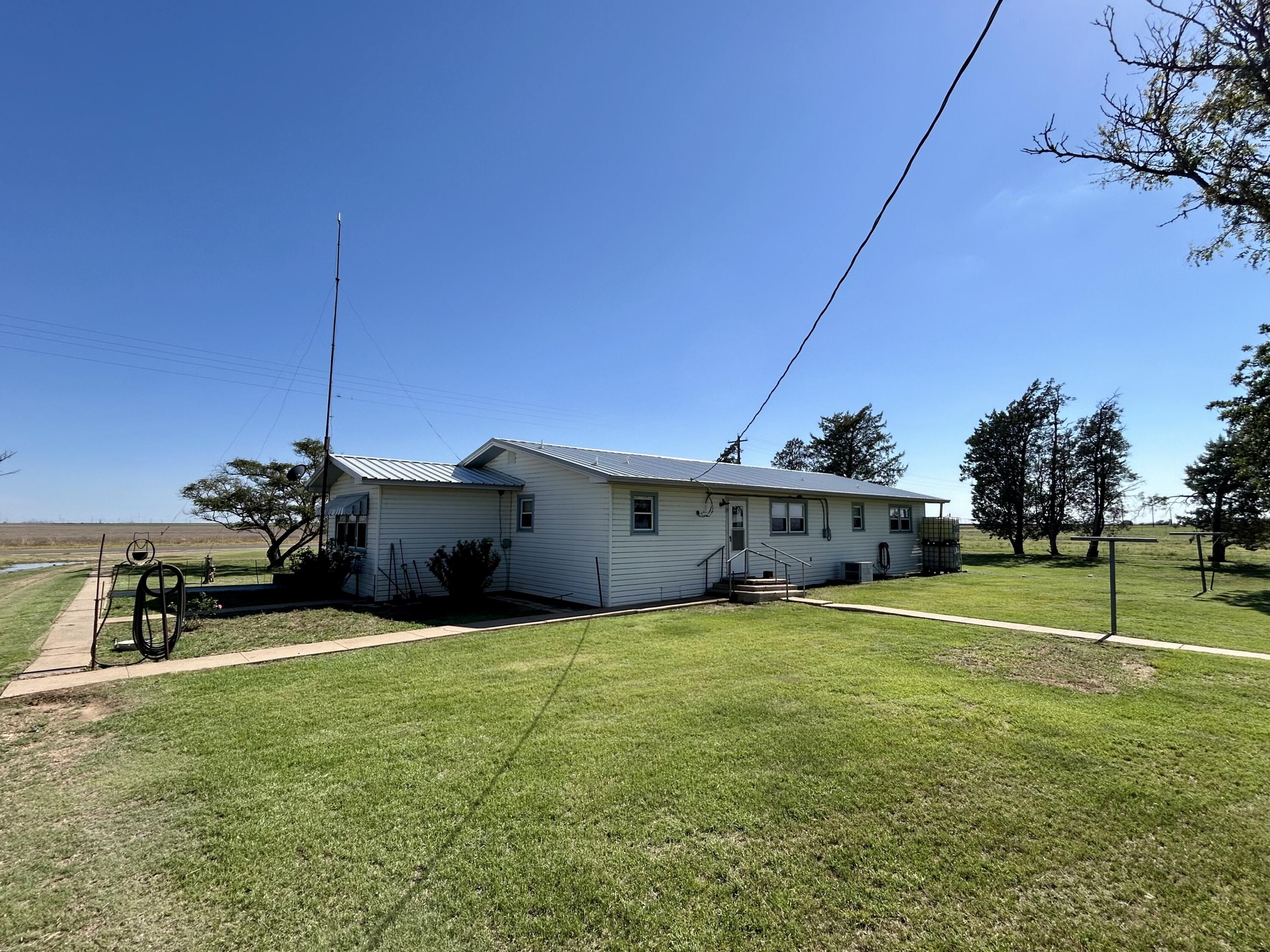 2101 Farm To Market 97 Lockney, TX 79241 - Photo 2 of 40 a view of a house with a yard and sitting area