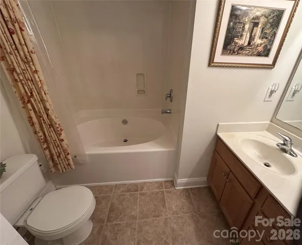 a bathroom with a bathtub sink and toilet