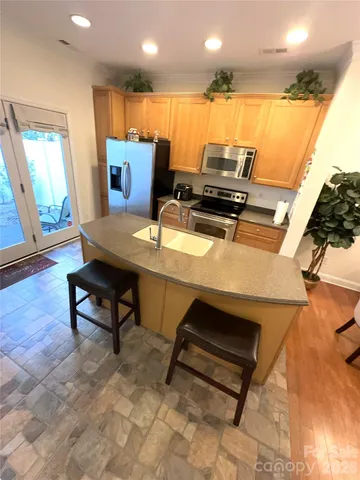 a living room with furniture pool table and a table