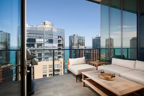 a living room with furniture a rug and a table