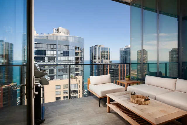 a living room with furniture a rug and a table