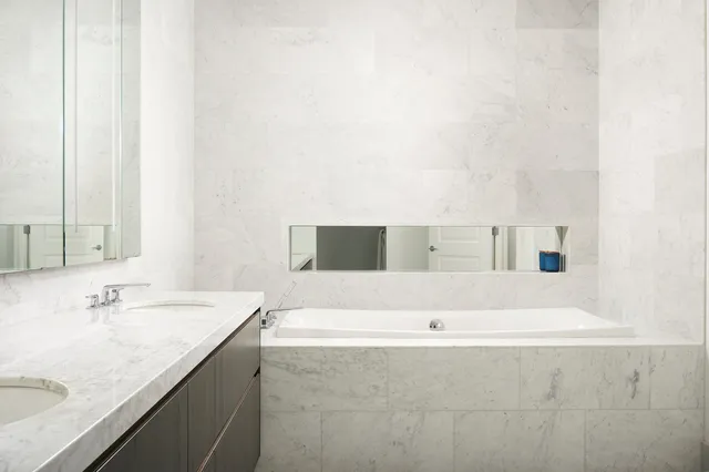 a bathroom with a bathtub and a sink