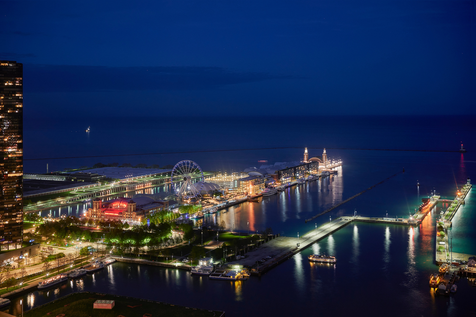 363 East Wacker Drive, Unit 3608 Chicago, IL 60601 - Photo 19 of 30 a view of a balcony with dining table and chairs