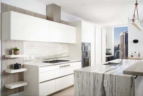 a kitchen with a stove and a refrigerator