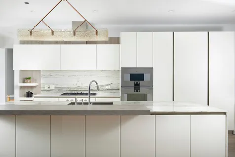 a kitchen with a sink cabinets and appliances