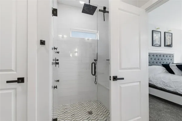 a bathroom with a double vanity sink and a mirror