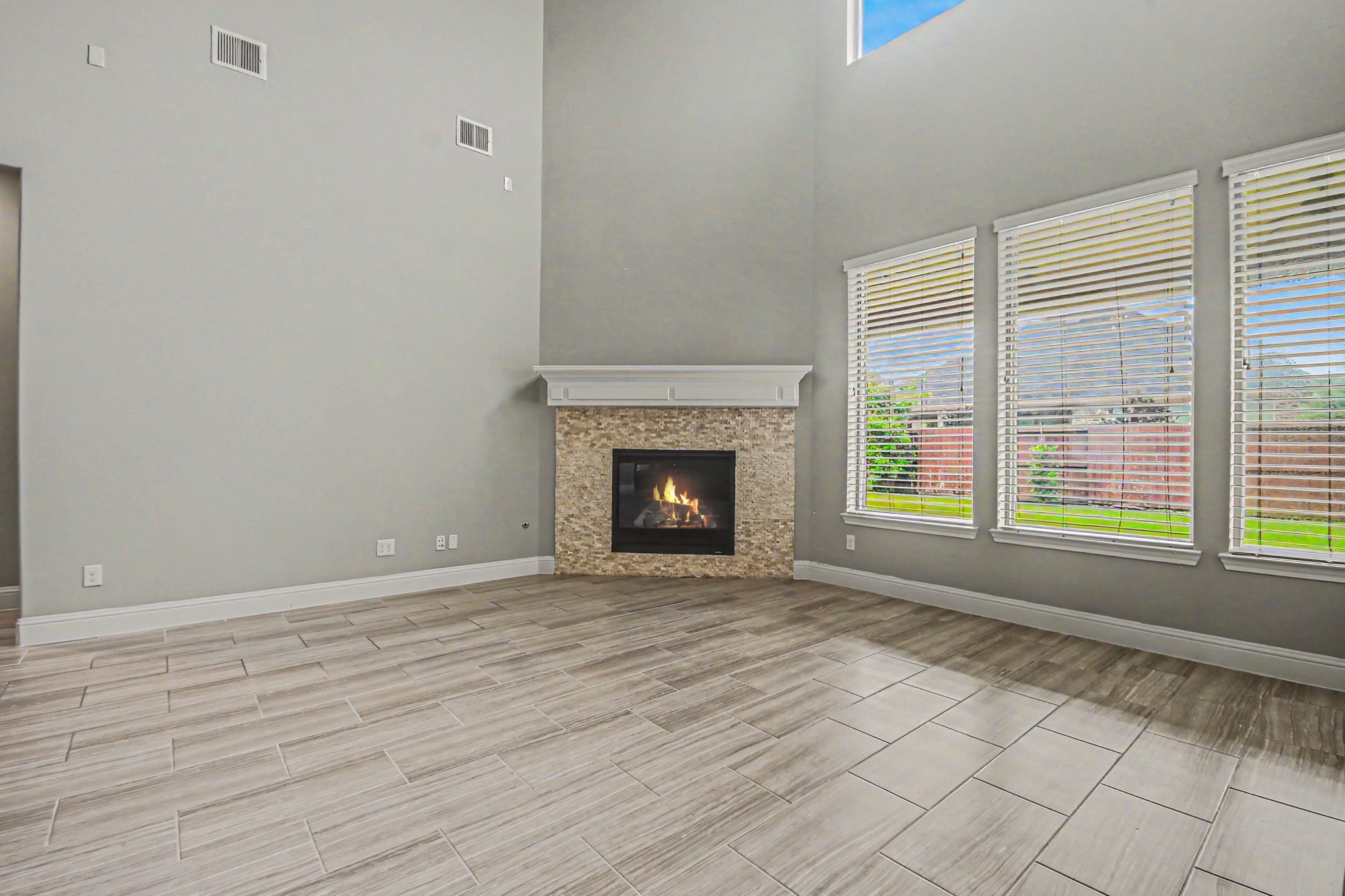3310 Ralston Edge Lane Houston, TX 77059 - Photo 12 of 50 a view of an empty room with a window and fireplace