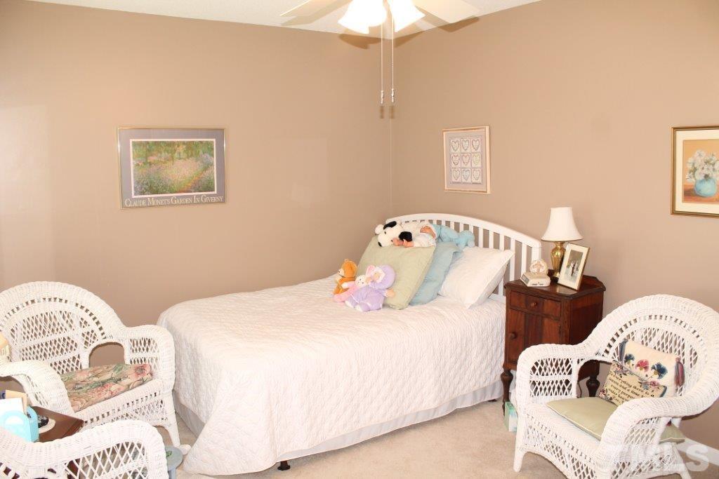 2707 Cottage Circle Raleigh, NC 27613 - Photo 13 of 21 a bedroom with two bed and a lamp