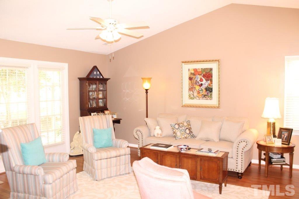 2707 Cottage Circle Raleigh, NC 27613 - Photo 5 of 21 a living room with furniture and a large window