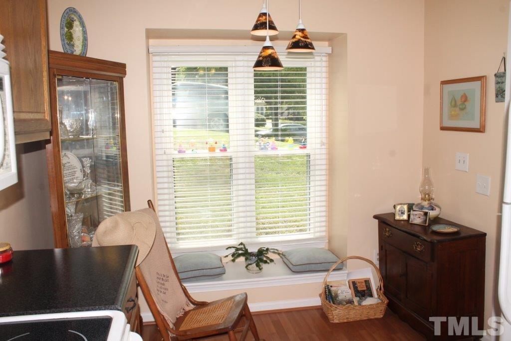 2707 Cottage Circle Raleigh, NC 27613 - Photo 9 of 21 a living room with furniture and a window