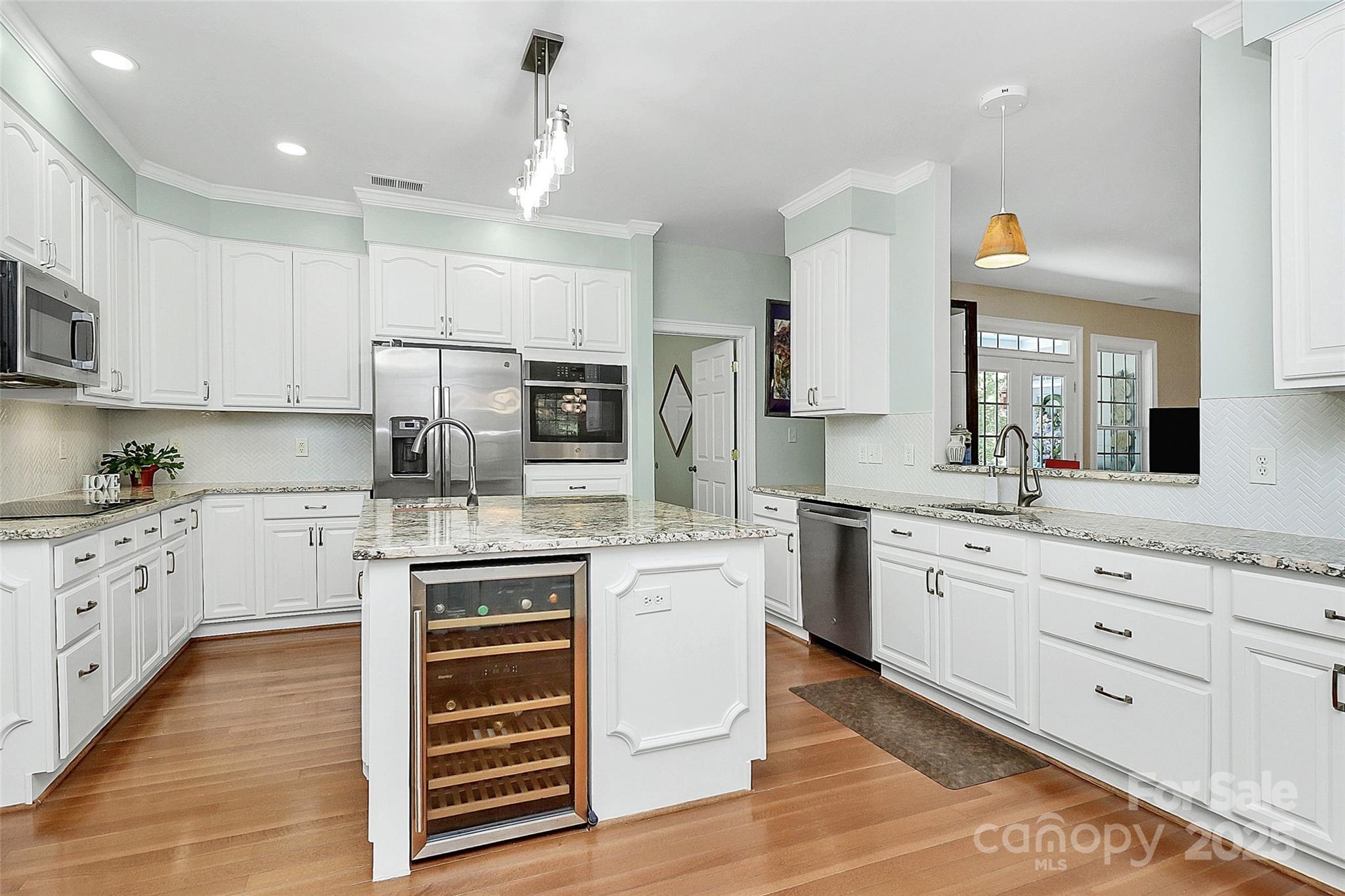 514 Bethel School Road Clover, SC 29710 - Photo 7 of 28 a kitchen with granite countertop white cabinets and white appliances