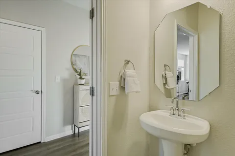 a bathroom with a sink a mirror and shower