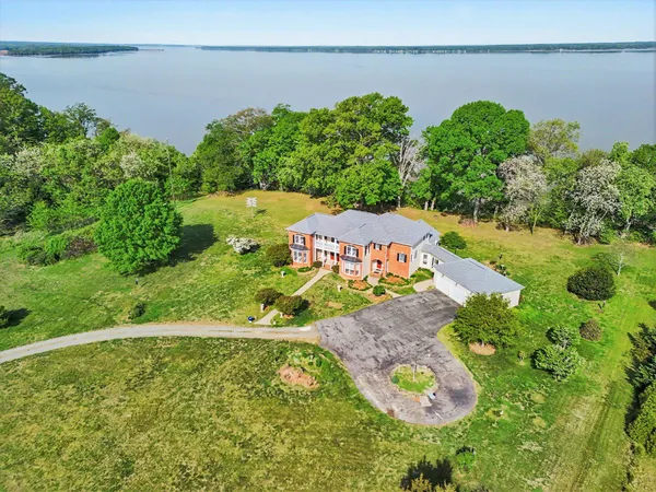 a front view of house with yard and trees