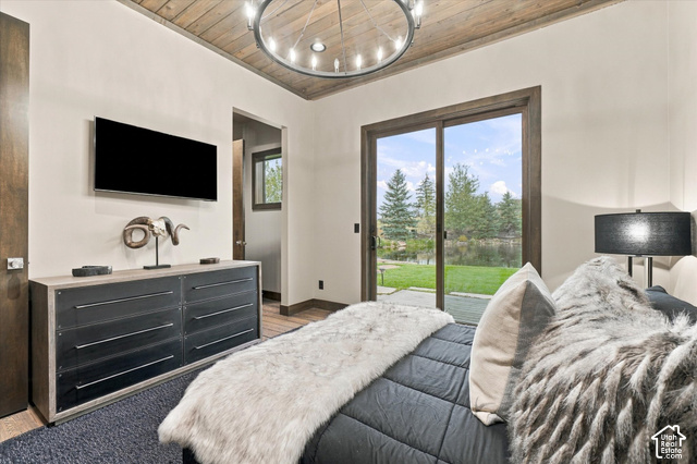 5936 Triple Crown Trail Oakley, UT 84055 - Photo 20 of 57 Wood-paneled ceiling with a circular chandelier