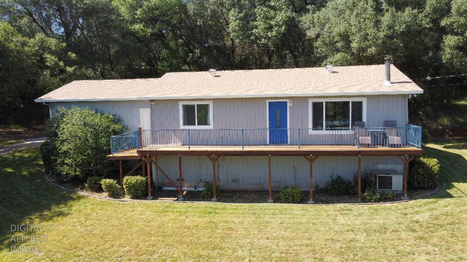 19310 Branding Iron Road Penn Valley, CA 95946 - Photo 1 of 30 a view of a house with a yard covered with snow in front of house