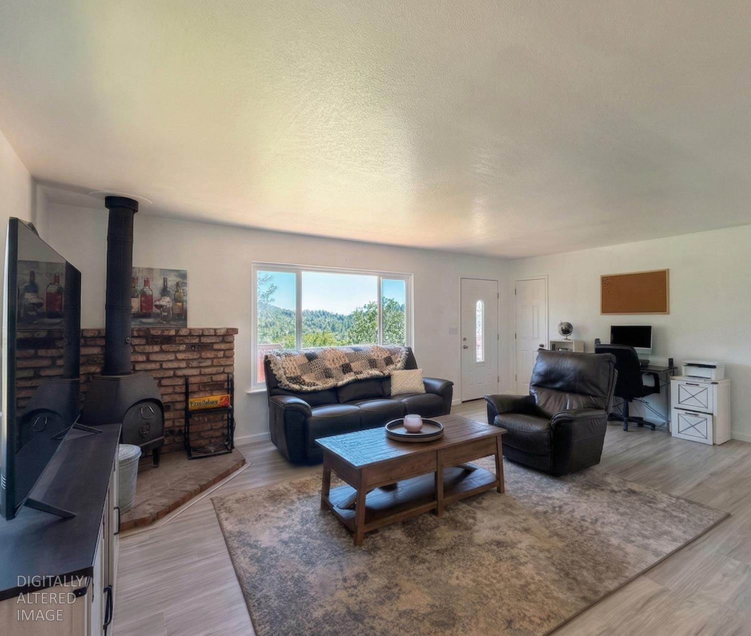 19310 Branding Iron Road Penn Valley, CA 95946 - Photo 11 of 30 a living room with furniture and a fireplace