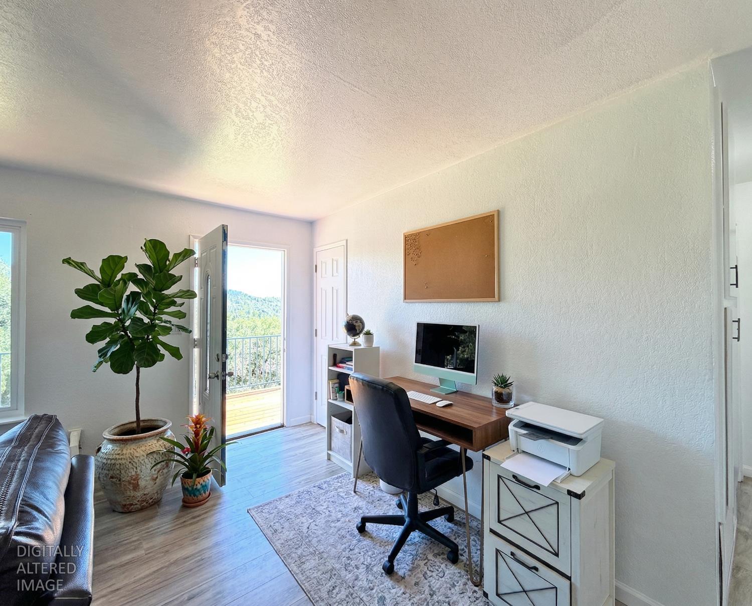 19310 Branding Iron Road Penn Valley, CA 95946 - Photo 17 of 30 a workspace with furniture and a potted plant