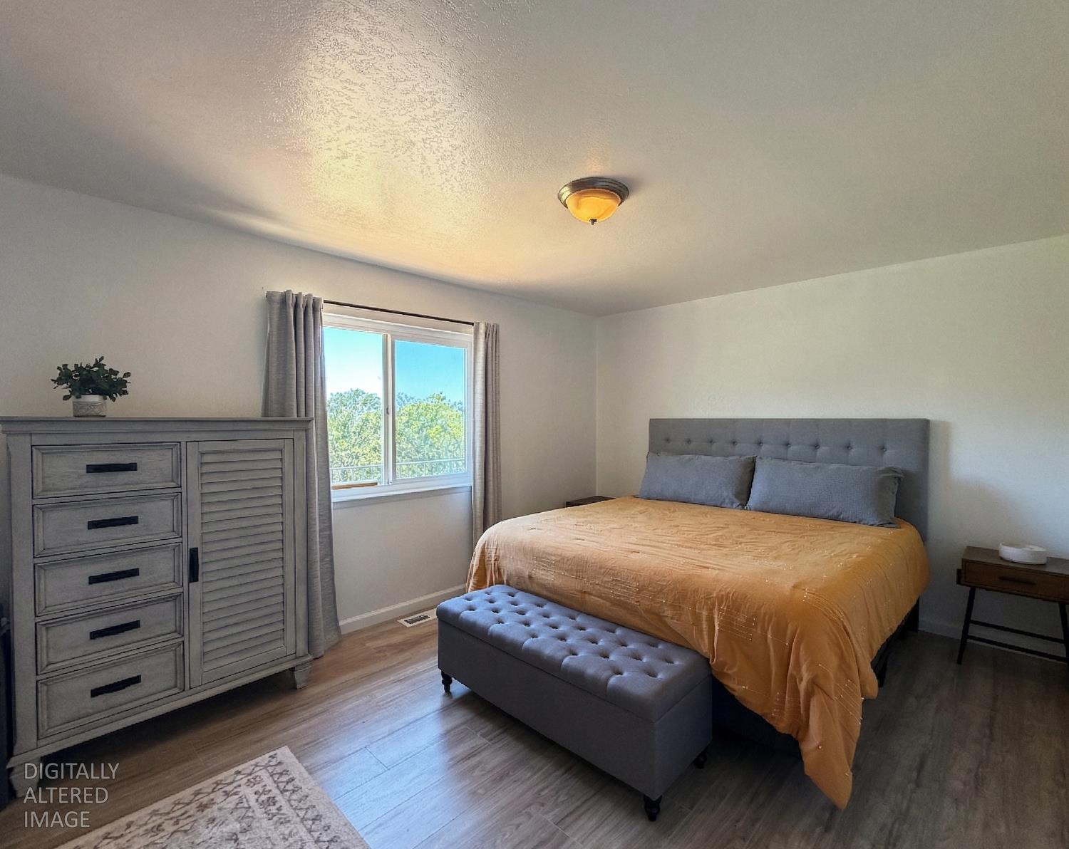 19310 Branding Iron Road Penn Valley, CA 95946 - Photo 18 of 30 a bedroom with a bed and a window