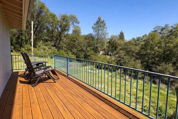 a view of a balcony with chairs