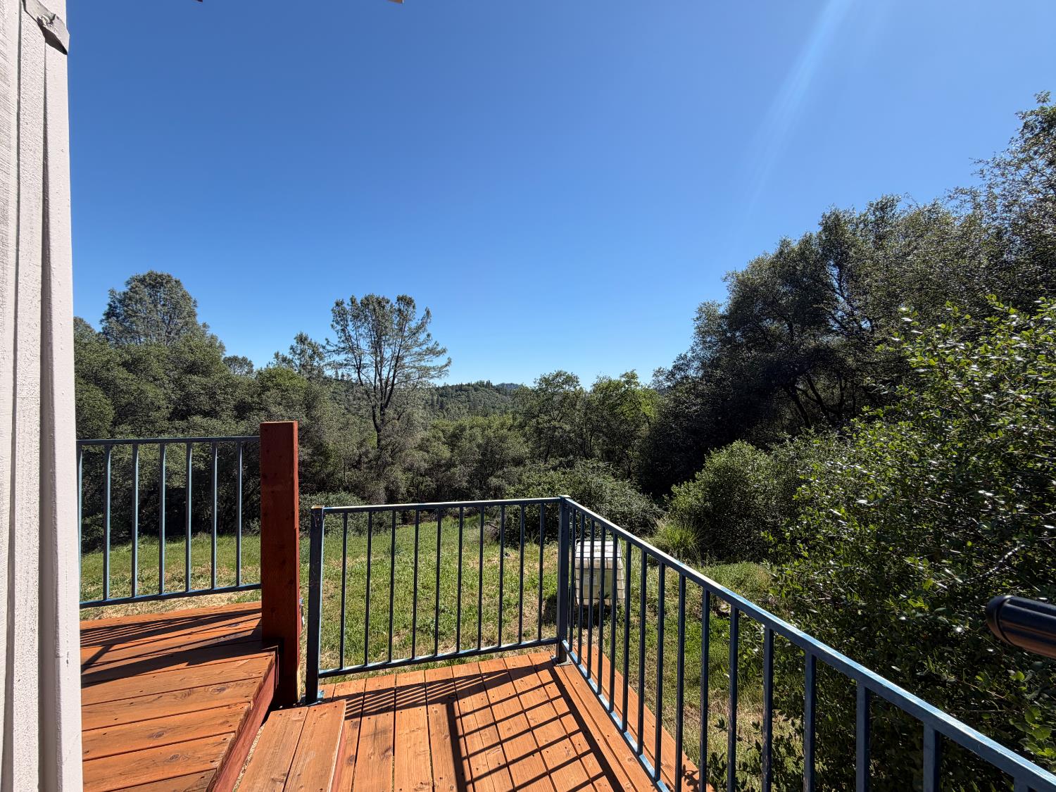 19310 Branding Iron Road Penn Valley, CA 95946 - Photo 25 of 30 a view of a balcony with wooden floor and fence
