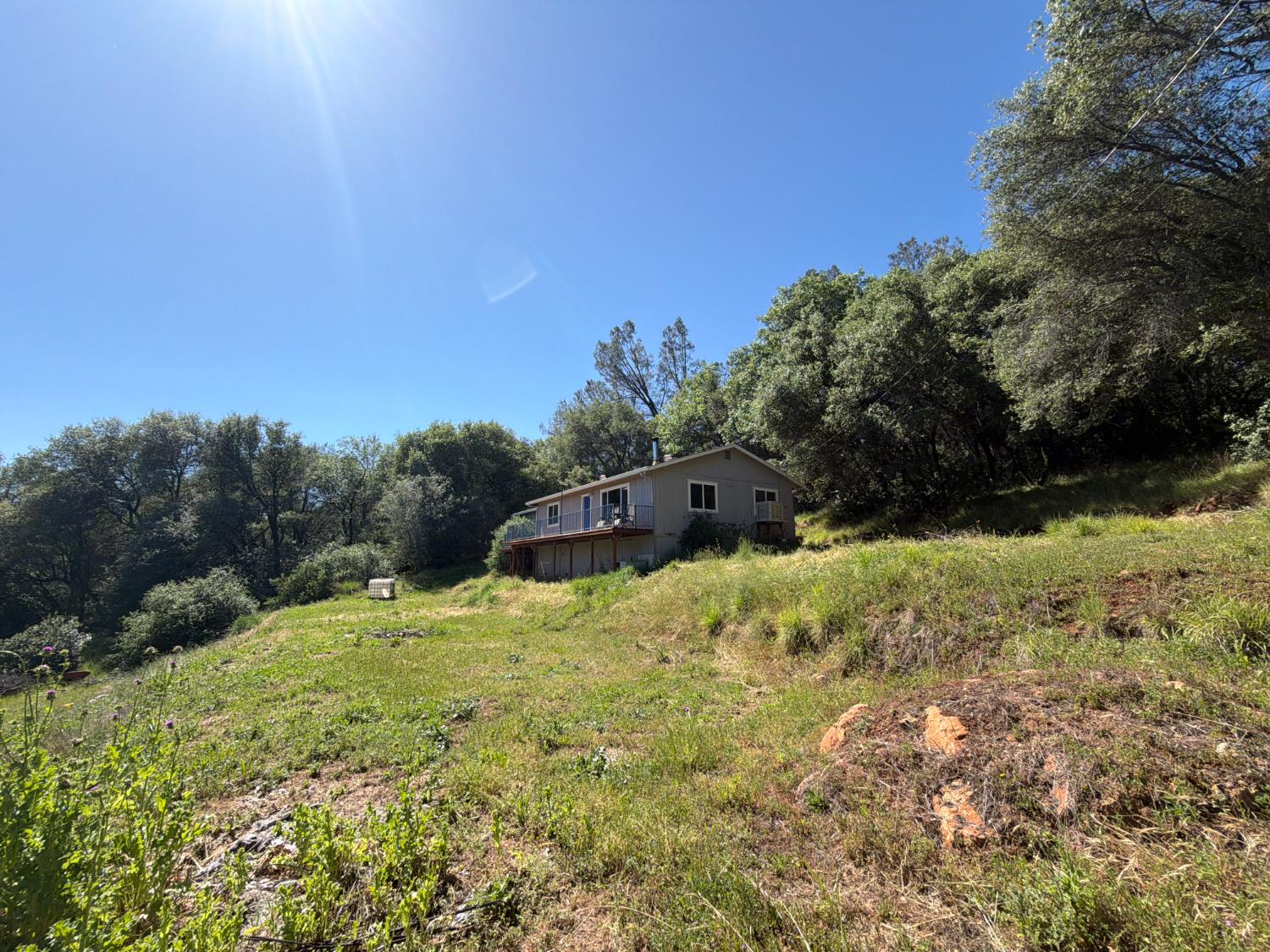 19310 Branding Iron Road Penn Valley, CA 95946 - Photo 27 of 30 a yard with a house