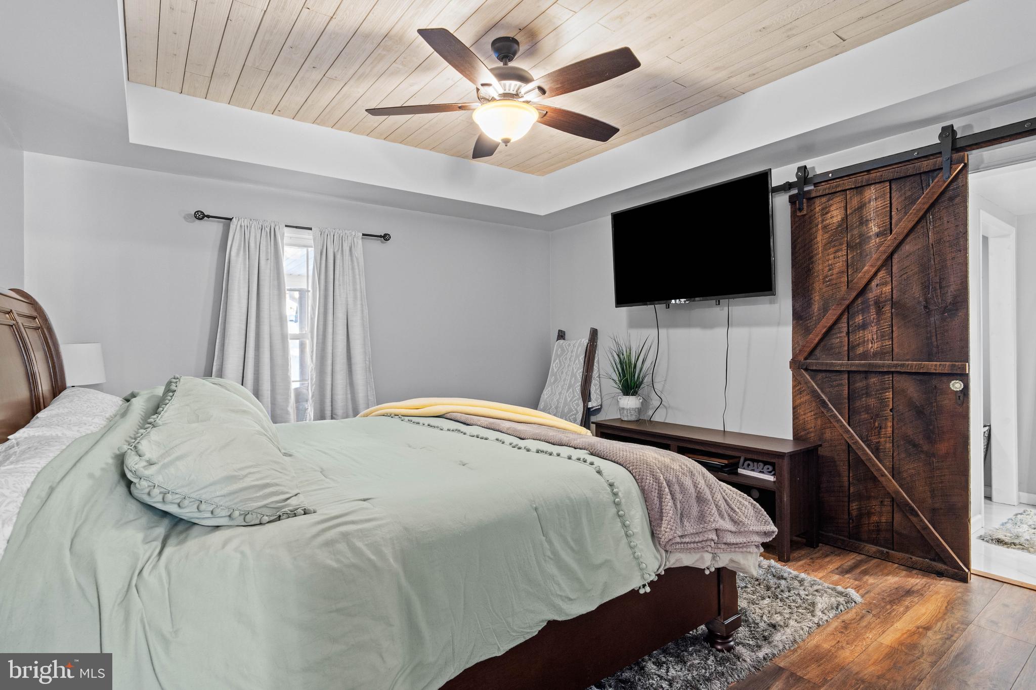197 Ridge Street Smokerun, PA 16681 - Photo 20 of 47 a bedroom with a bed and a flat screen tv