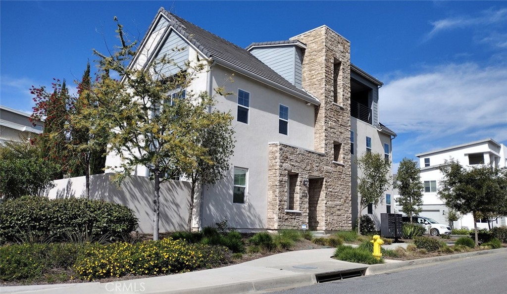 153 Crossover Irvine, CA 92618 - Photo 1 of 1 a front view of a house with a yard