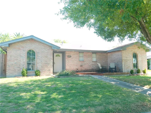 a view of a backyard with a garden and plants