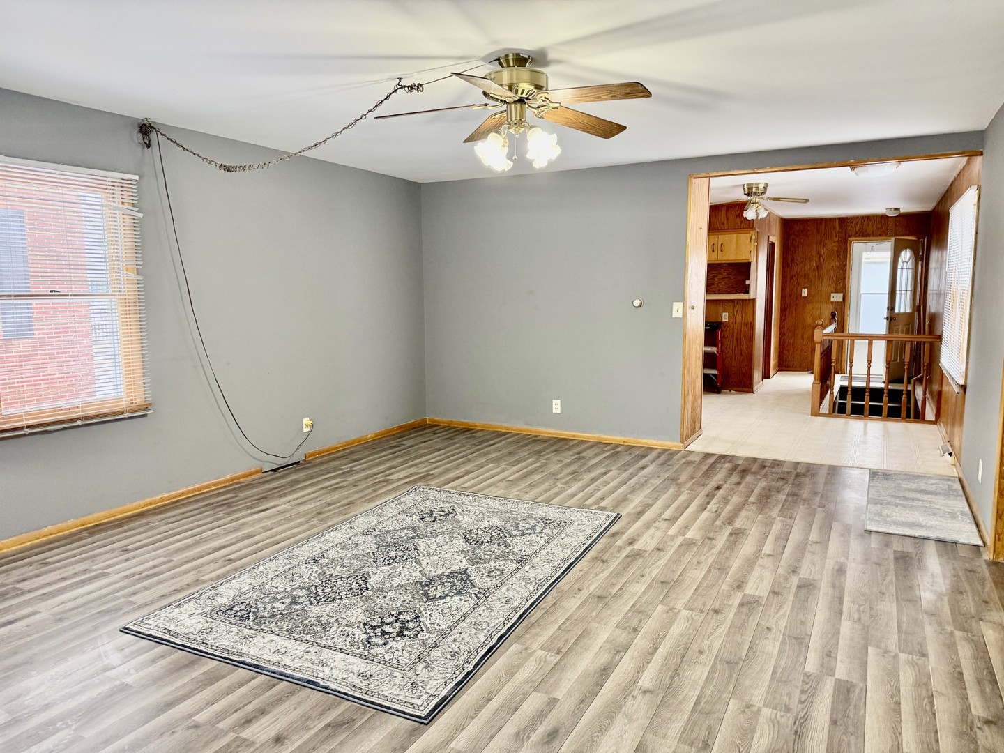205 6th Avenue Mendota, IL 61342 - Photo 7 of 32 a view of a hallway to a house with wooden floor