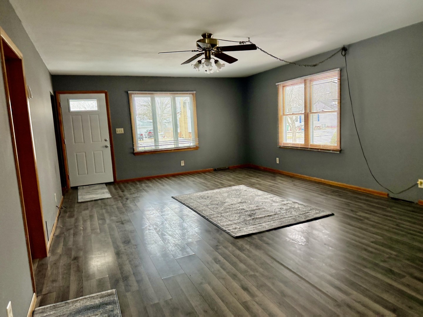205 6th Avenue Mendota, IL 61342 - Photo 9 of 32 a view of livingroom with hardwood floor and a ceiling fan
