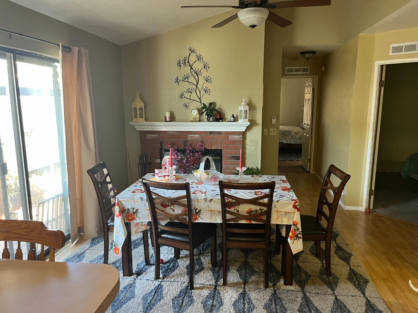 500 North Tully Road, Unit 39 Turlock, CA 95380 - Photo 9 of 23 a view of a dining room with furniture and wooden floor