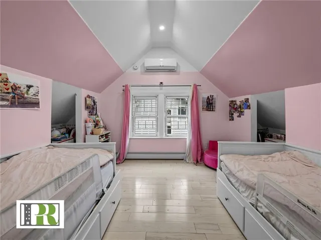 a spacious bedroom with a bed and a walk in closet