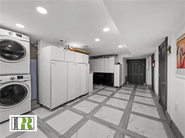 a view of a hallway with washer and dryer