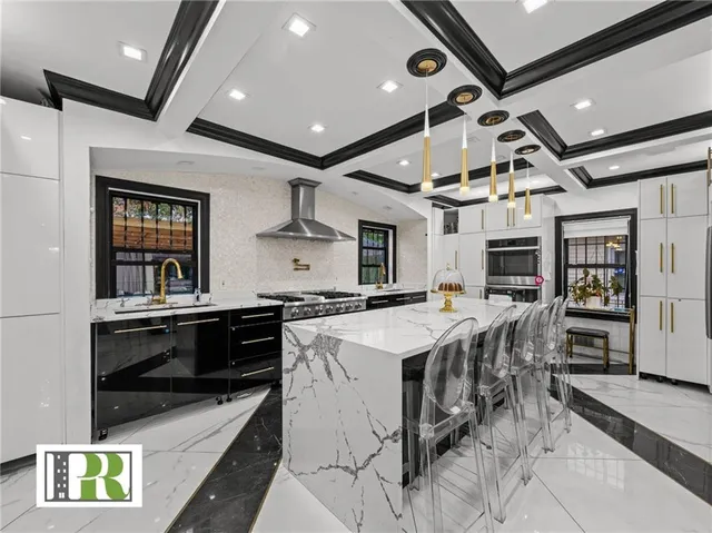 a kitchen with a stove a refrigerator and wooden cabinets
