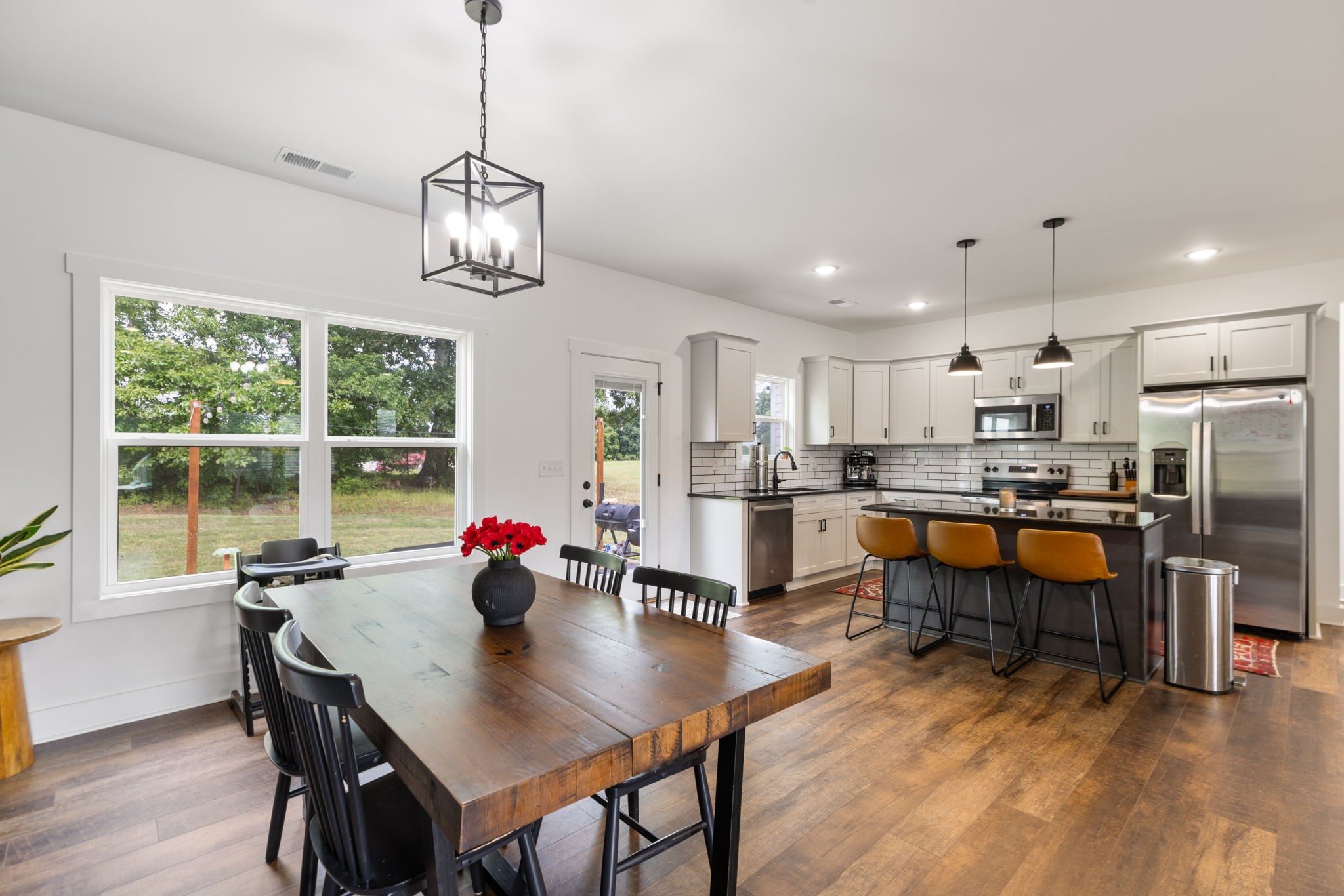 1578 Angus Way Greenbrier, TN 37073 - Photo 12 of 45 a living room with stainless steel appliances granite countertop furniture dining table a kitchen island with large windows