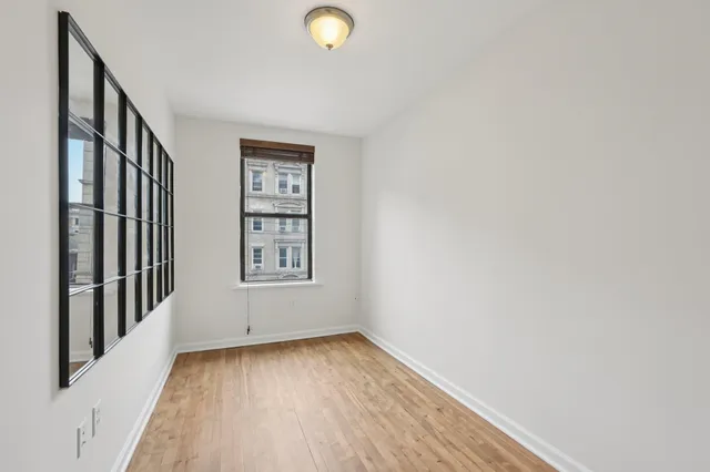 a view of livingroom with hardwood floor and window