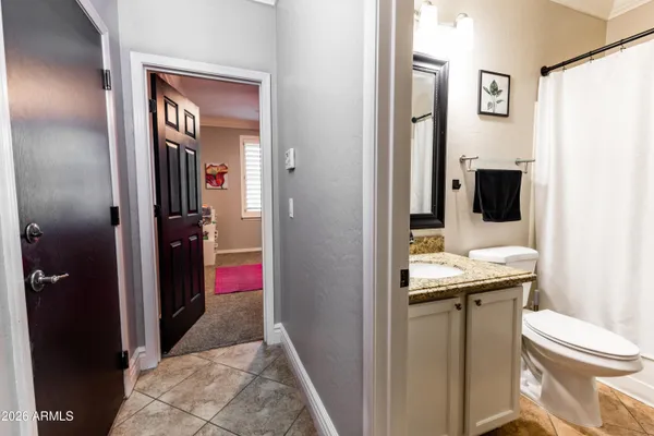 a en suite bathroom with a sink and mirror