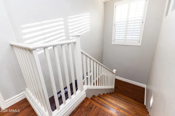 a view of wooden floor and a window